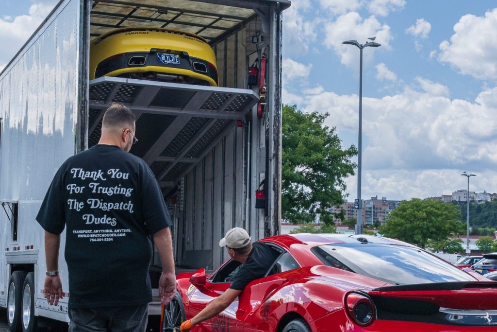 Loading cars into a carrier.