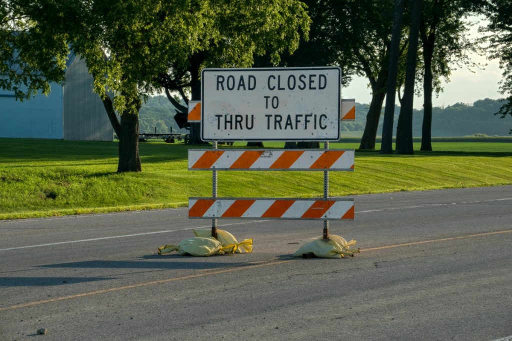 car shipping delivery issues 3 Traffic sign signaling that a road is closed.