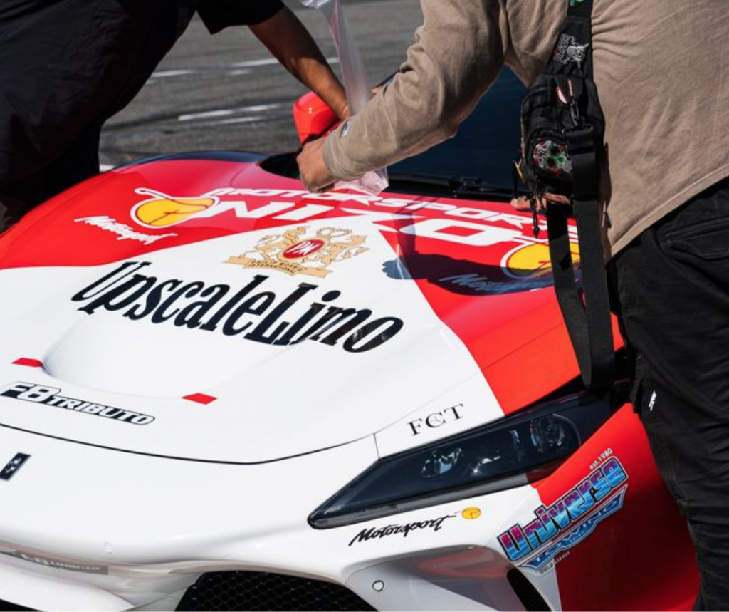 Two men preparing a car to be shipped to NYC.
