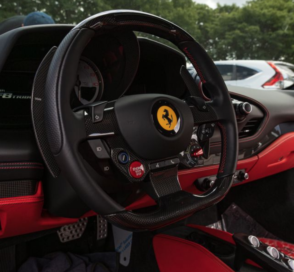 A Ferrari with a red leather interior.