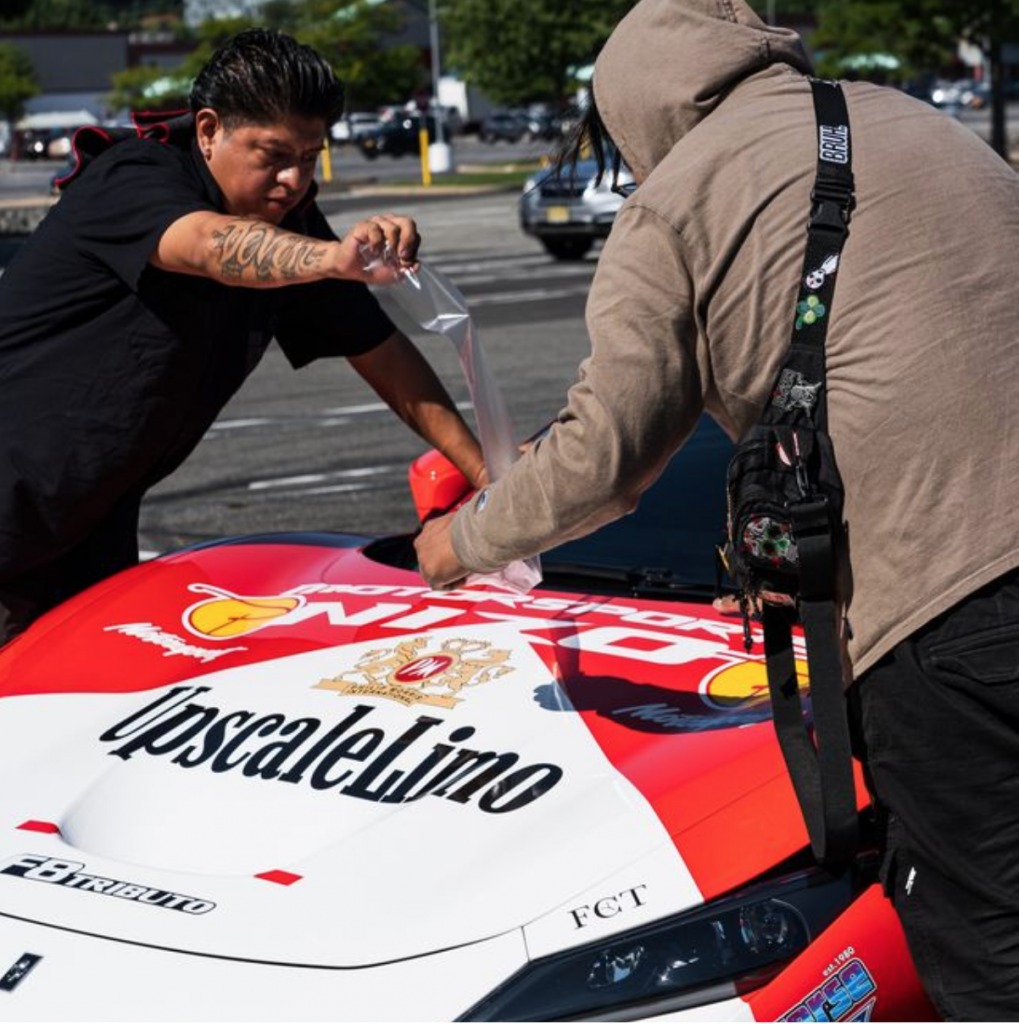 Dispatch Dudes wrapping a car for Arizona shipment.