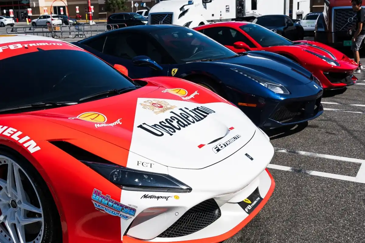 Lineup of Ferrari cars prepared for transport.