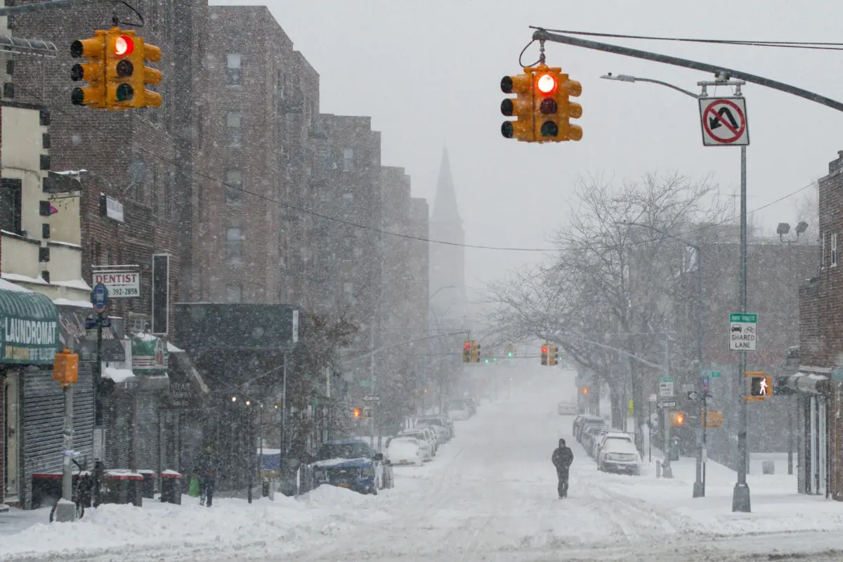 Snow-covered city street illustrating a weather-related transport delay.